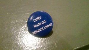 Photo by Brandon Jordan A button left at the Professional Staff Congress' mass meeting at Cooper Union on Nov. 19. Adjuncts make up 59 percent of faculty in CUNY, according to the CUNY Adjunct Project. However, they are paid only $2,300 for each course they teach.