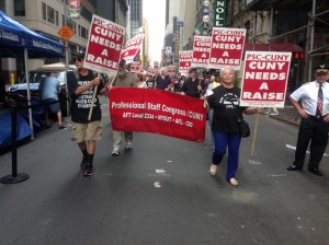 Photo by Brandon Jordan PSC members and supporters at the Labor Day Parade highlighted the lack of a contract for CUNY staff and professors.