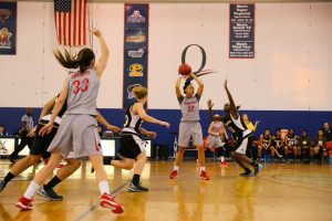 PHOTO COURTESY OF JOHN HIGGINS Seniors Kristin Korzevinski and Mackenzie Rowland playing against Molloy  College. Both players achieved the milestone of 1,000 career points. 