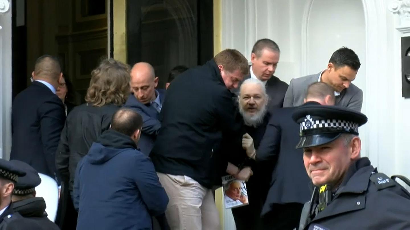 Photo Credit: Jack Taylor Getty Images Caption: Assange, arrested and on his way to jail.