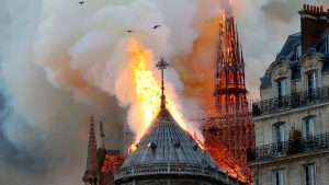 Credit: New York Times Caption: The spire of the Notre Dame Cathedral burning.